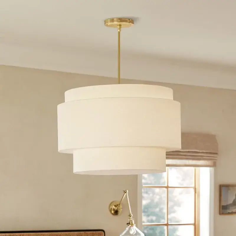 A Japanese minimalist cream tiered pendant lamp with three white fabric shades by decorbites camden for kitchen lighting