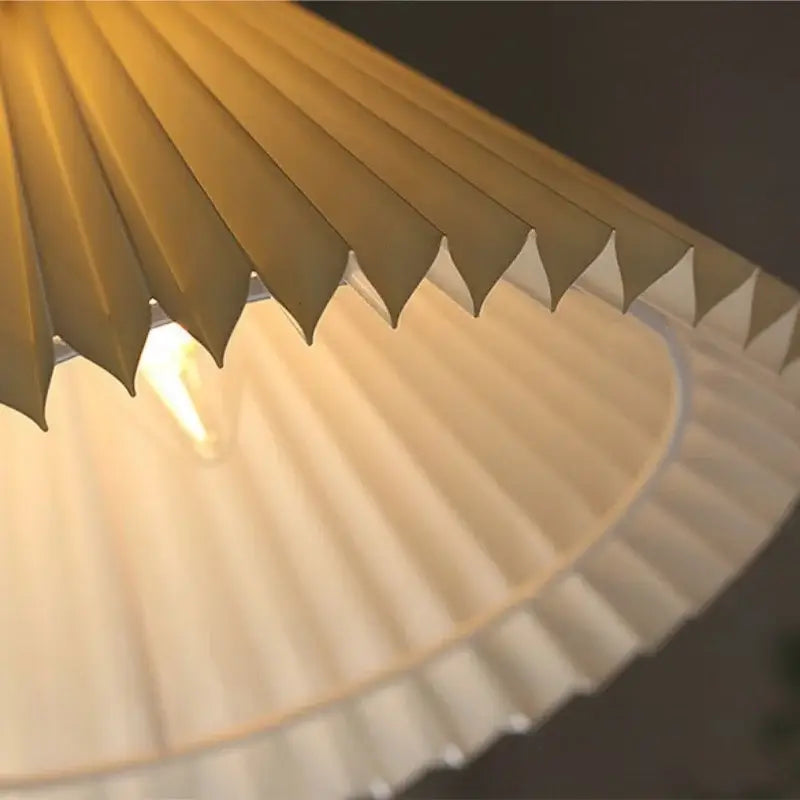 Warm-toned pleated paper pendant light with led walnut wood frame providing soft diffused glow for living room decorbites led walnut