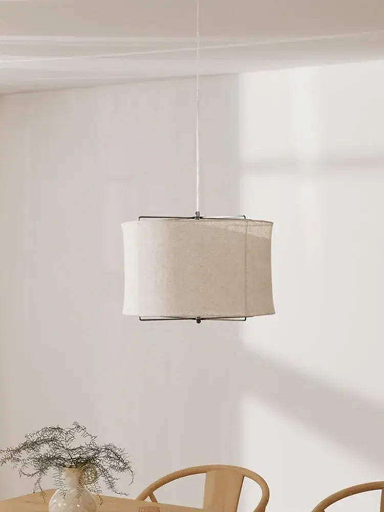 Minimalist linen fabric chandelier with an off-white decorbites linen shade and black metal frame for bedroom lighting