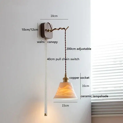 A warm-toned ceramic led wall light with ribbed texture hanging from copper socket on walnut canopy for bedroom decorbites ceramic led
