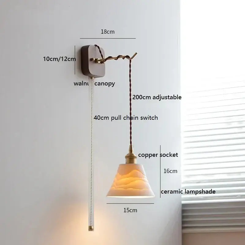 A warm-toned ceramic led wall light with ribbed texture hanging from copper socket on walnut canopy for bedroom decorbites ceramic led