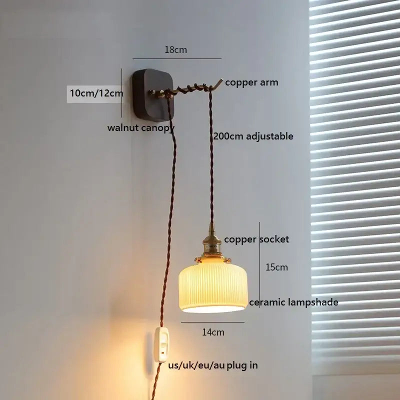 A warm-toned ceramic led wall light with vertical ridges suspended by a copper arm from a walnut canopy decorbites ceramic led