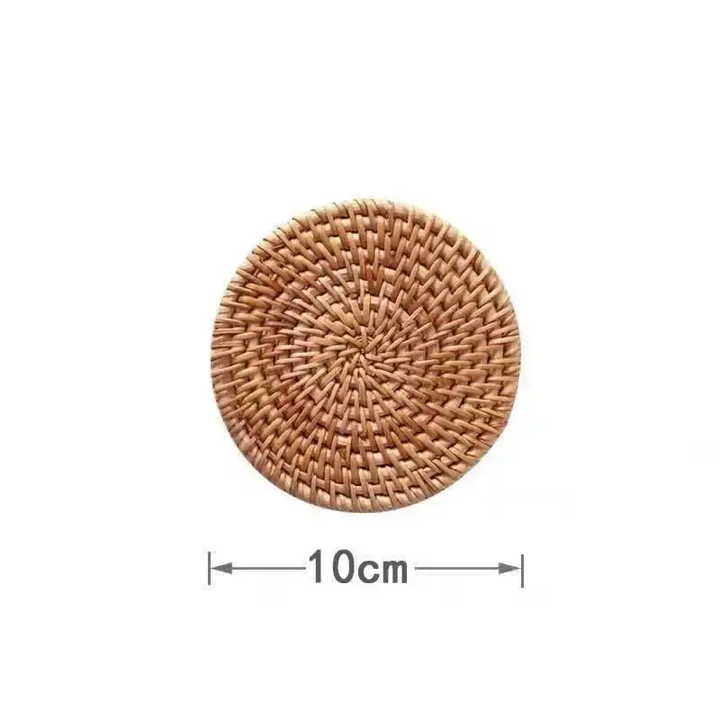 A round 10cm diameter natural brown rattan coaster with a tight concentric pattern for decorbites glass coffee cup set