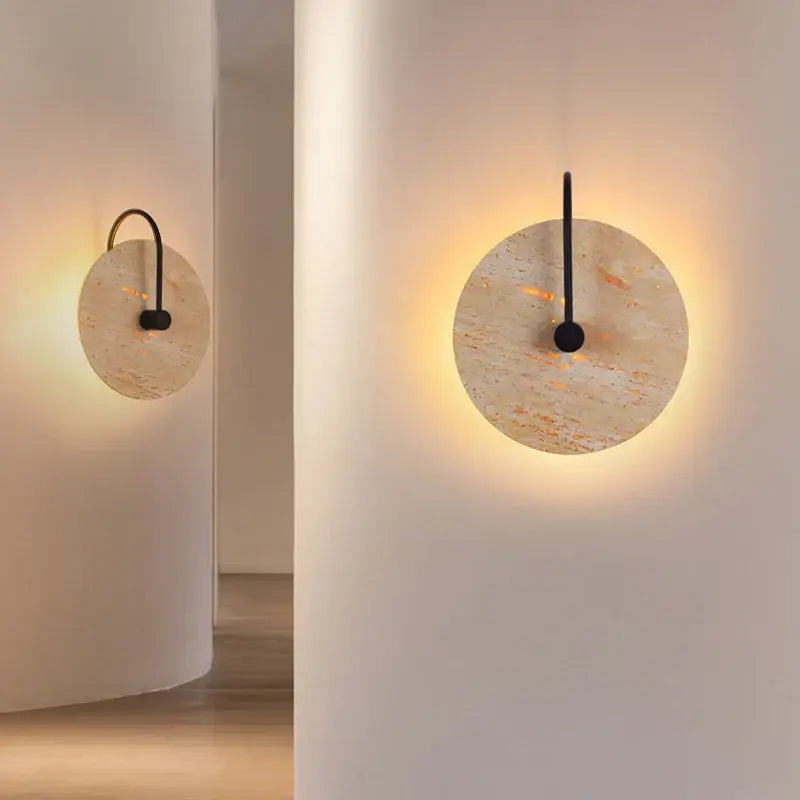 Circular beige stone and iron led wall lights with warm glow and black metal accents for bedroom decorbites iron led wall
