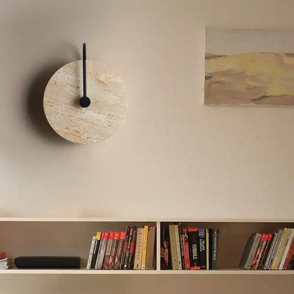 Circular wall clock with light beige textured cork face and sleek black hands complements decorbites iron led wall lights