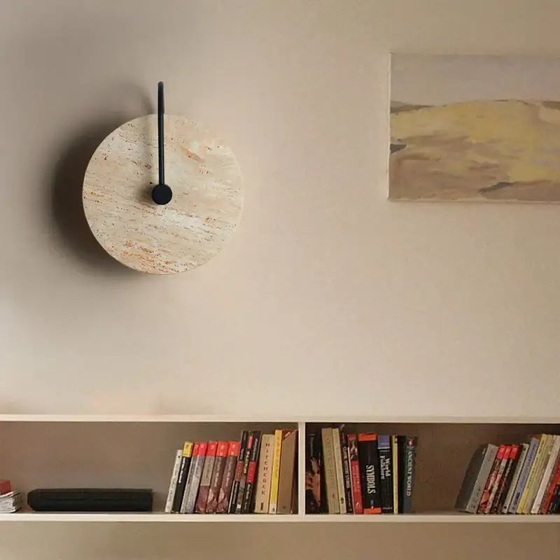 Circular wall clock with light beige textured cork face and sleek black hands complements decorbites iron led wall lights