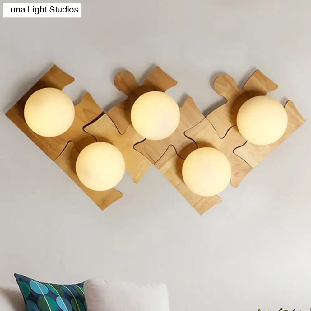 Set of three beige wooden puzzle base wall lights with warm-glowing bulbs ideal for corridor lighting