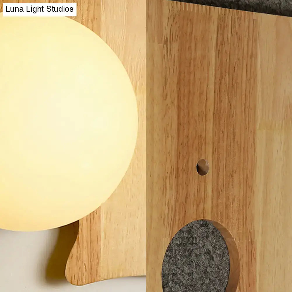 Japanese style beige wall light with a warm-toned spherical lamp and wooden puzzle base for corridor lighting