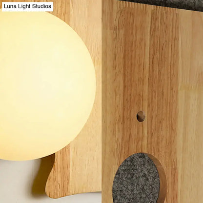 Japanese style beige wall light with a warm-toned spherical lamp and wooden puzzle base for corridor lighting