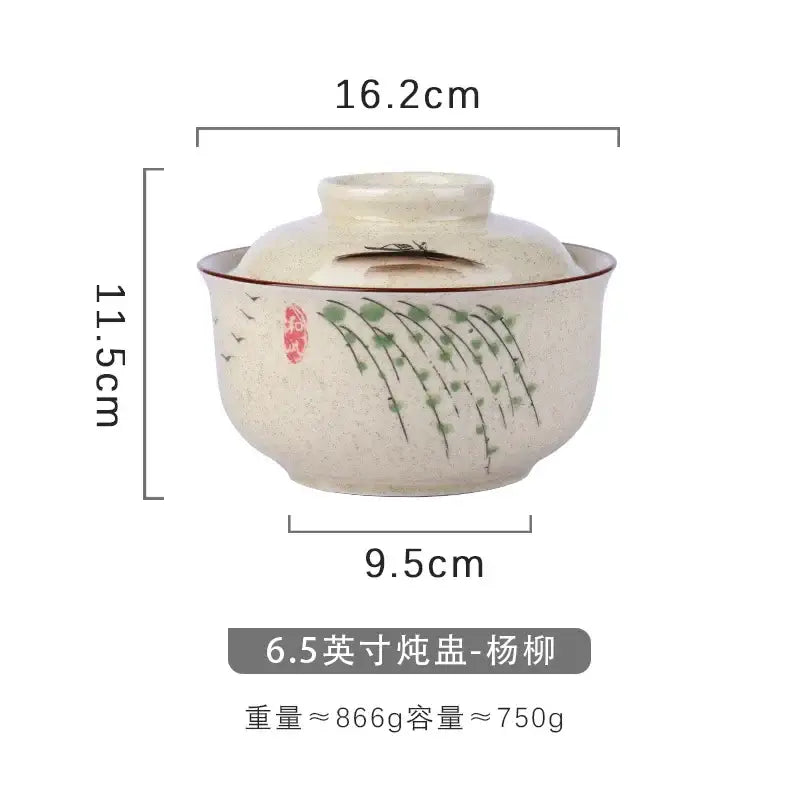 Cream-colored ceramic teapot with lid featuring hand-painted green willow branches and birds in japanese style decorbites ramen bowl setting