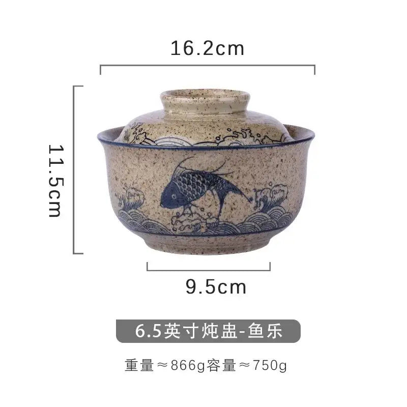 A japanese style ceramic ramen bowl with speckled beige glaze blue hand-painted fish design and attached lid decorbites