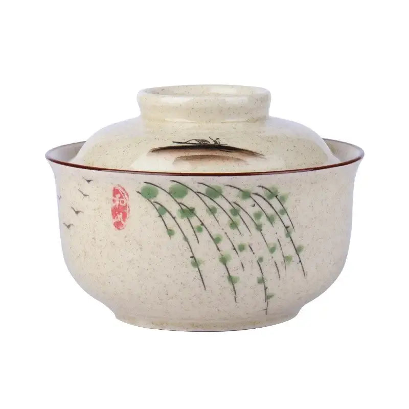 Beige ceramic japanese style ramen bowl with lid featuring green willow branch and bird motifs and red seal stamp