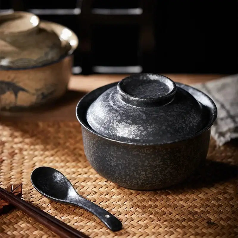 Dark gray speckled ceramic japanese style ramen bowl with matching lid and black spoon by decorbites japanese style