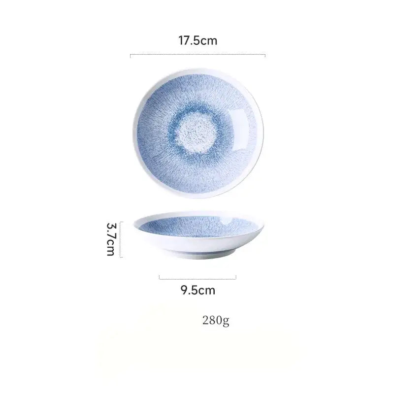 Japanese style blue and white ceramic deep dish bowl with a soft radial brushstroke pattern and smooth white rim