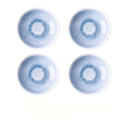 Set of four Japanese style blue and white ceramic deep dish bowls with delicate radial glaze and white rims