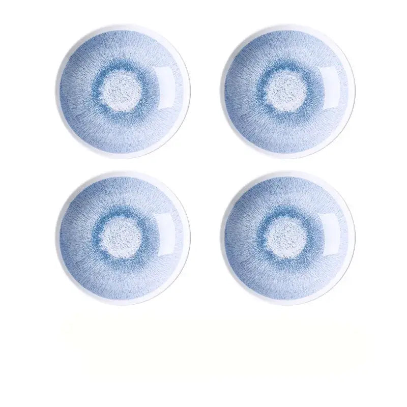 Set of four Japanese style blue and white ceramic deep dish bowls with delicate radial glaze and white rims