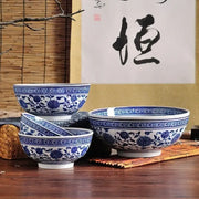 Set of three japanese style blue and white ceramic noodle bowls with intricate floral patterns for dining use