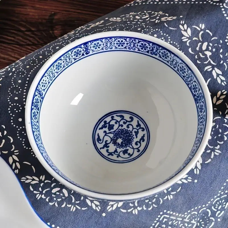Japanese style blue and white ceramic noodle bowl with intricate floral patterns and classic porcelain finish set of 3