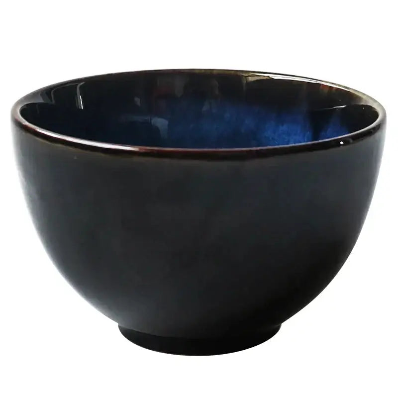 Glossy black ceramic salad bowl with a deep blue speckled interior from decorbites salad bowl set