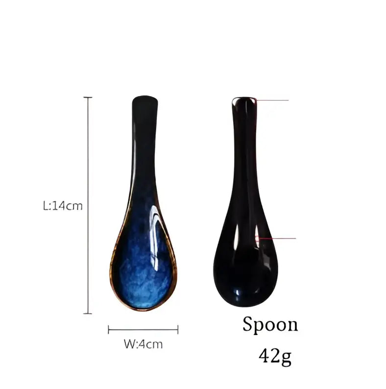 A sleek glossy black ceramic spoon with deep blue glaze accent from decorbites ceramic salad bowl set