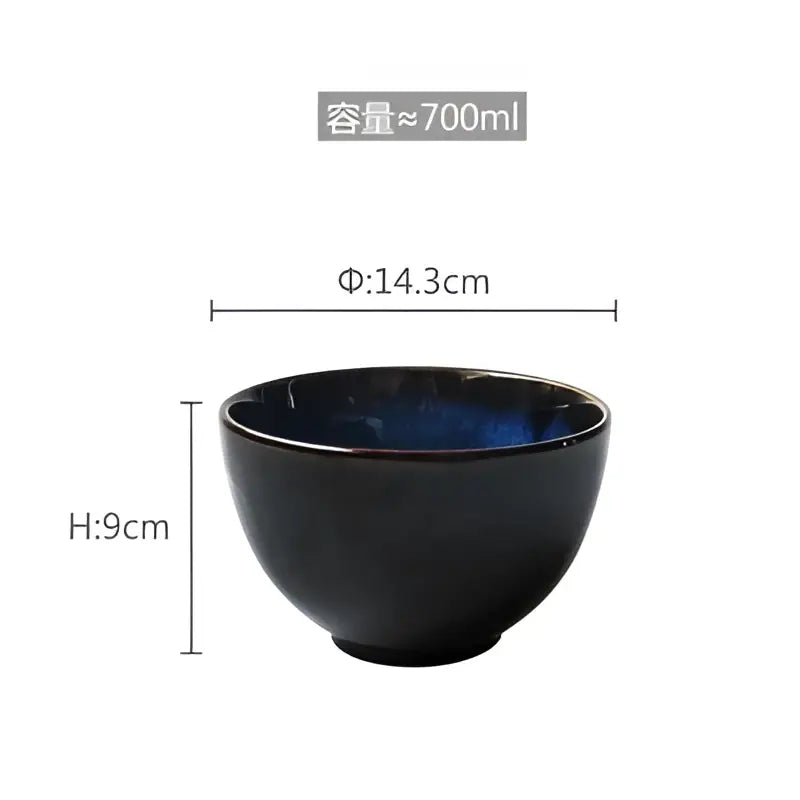 A sleek black ceramic salad bowl with glossy finish and deep blue interior from decorbites salad bowl set
