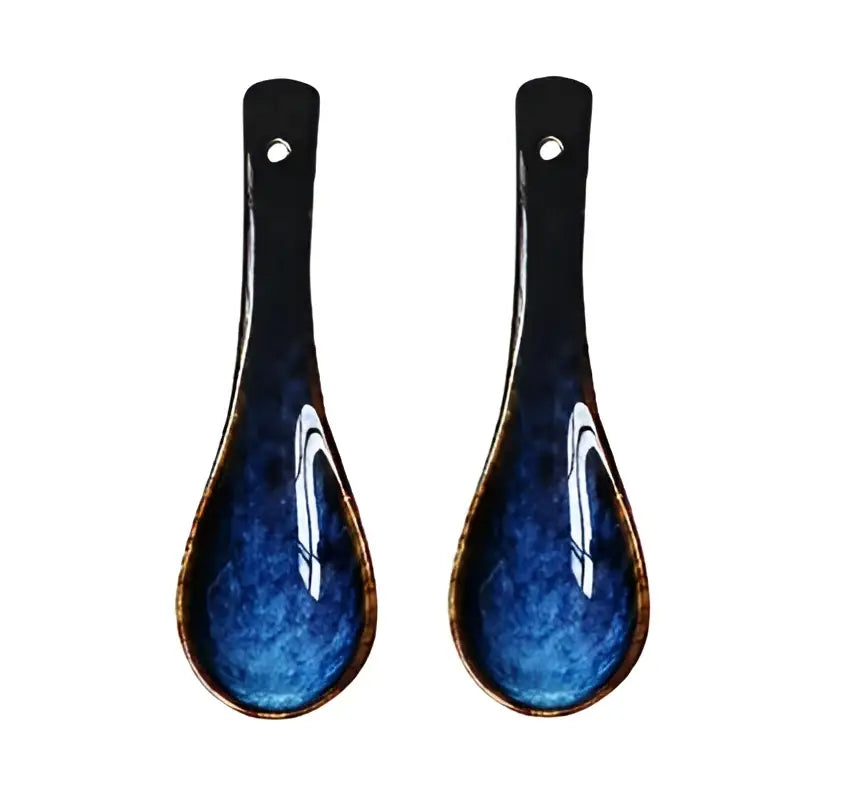 Pair of blue ceramic spoon rests with glossy glaze and white abstract swirls for decorbites ceramic salad bowl set