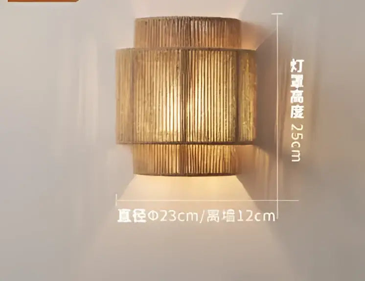 Golden cylindrical wall sconce with textured woven bamboo design and tiered sections for decorbites hemp rope pendant lights