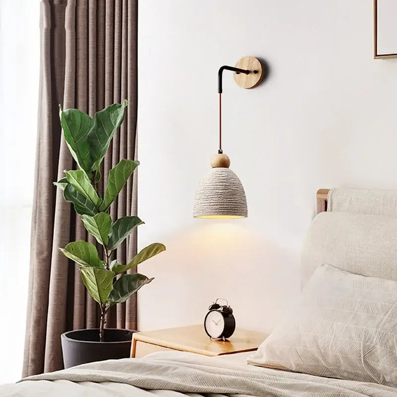 A warm-toned decorbites japanese style led wood wall light with woven shade and pull chain for bedroom decor