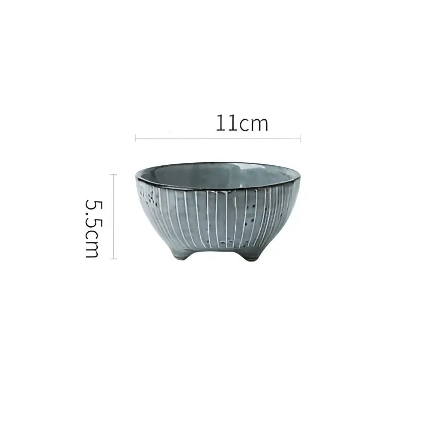 A small handcrafted ceramic sauce dishes rice bowl with matte sage green glaze and subtle vertical ridges for dining use