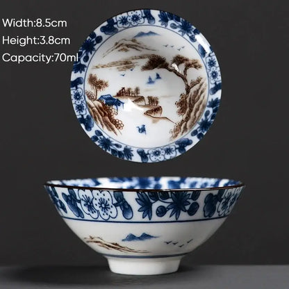 A delicate white ceramic kung fu tea cup with intricate blue and brown hand-painted chinese motifs by decorbites blue