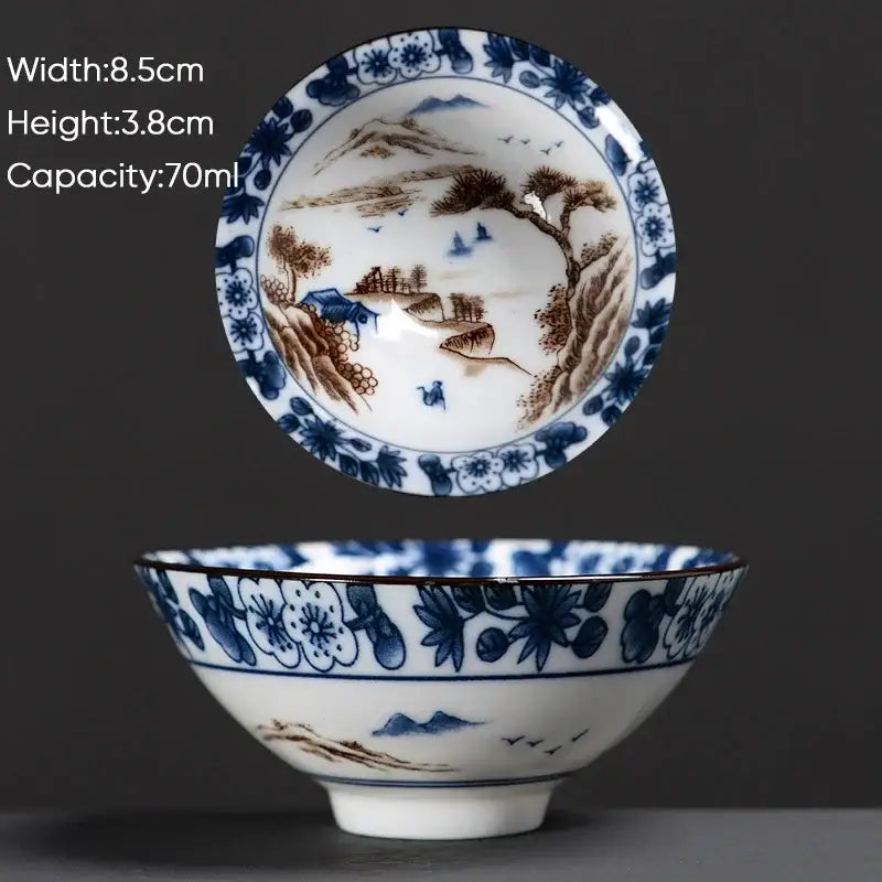 A delicate white ceramic kung fu tea cup with intricate blue and brown hand-painted chinese motifs by decorbites blue