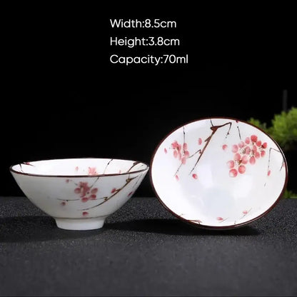 White ceramic kung fu tea bowl with pink cherry blossom and brown branch patterns for decorbites blue dining room set