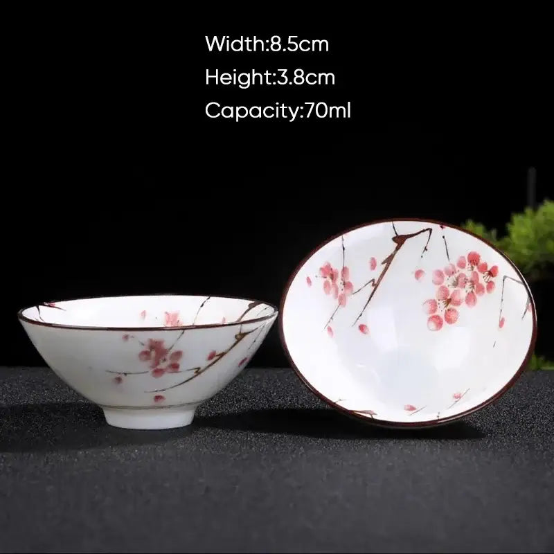 White ceramic kung fu tea bowl with pink cherry blossom and brown branch patterns for decorbites blue dining room set