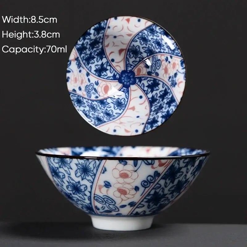 A delicate white ceramic kung fu tea cup with blue and peach floral pattern for Japanese style dining decorbites blue