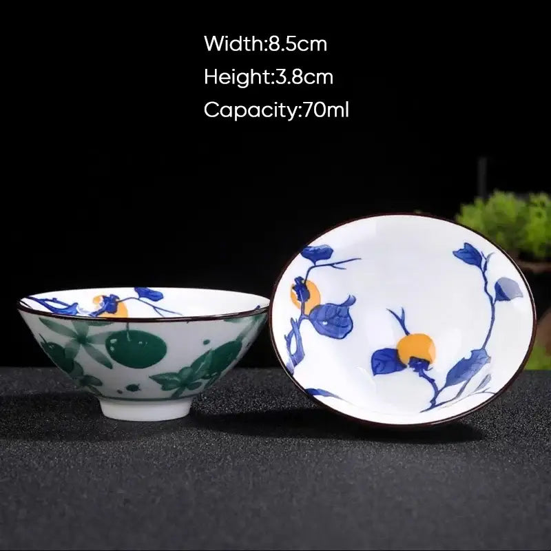 White ceramic kung fu tea cup with blue and green hand-painted fruit motifs and dark rim by decorbites blue