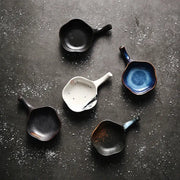Handcrafted japanese style retro ceramic condiment dishes in black white blue and earthy tones with glossy glaze
