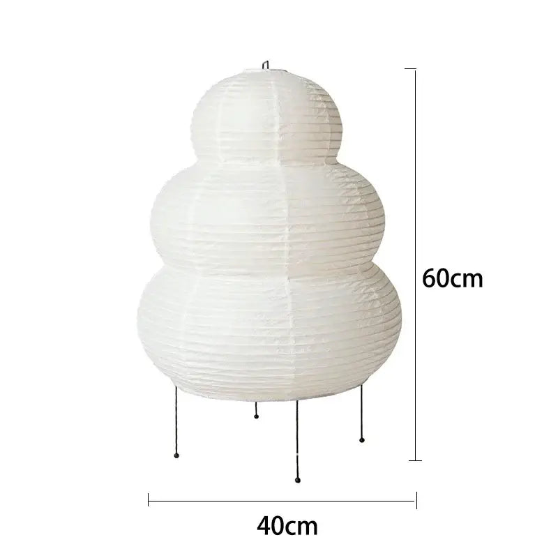 White paper lantern desk lamp with three rounded tiers on a black metal stand for decorbites japanese style rice lighting