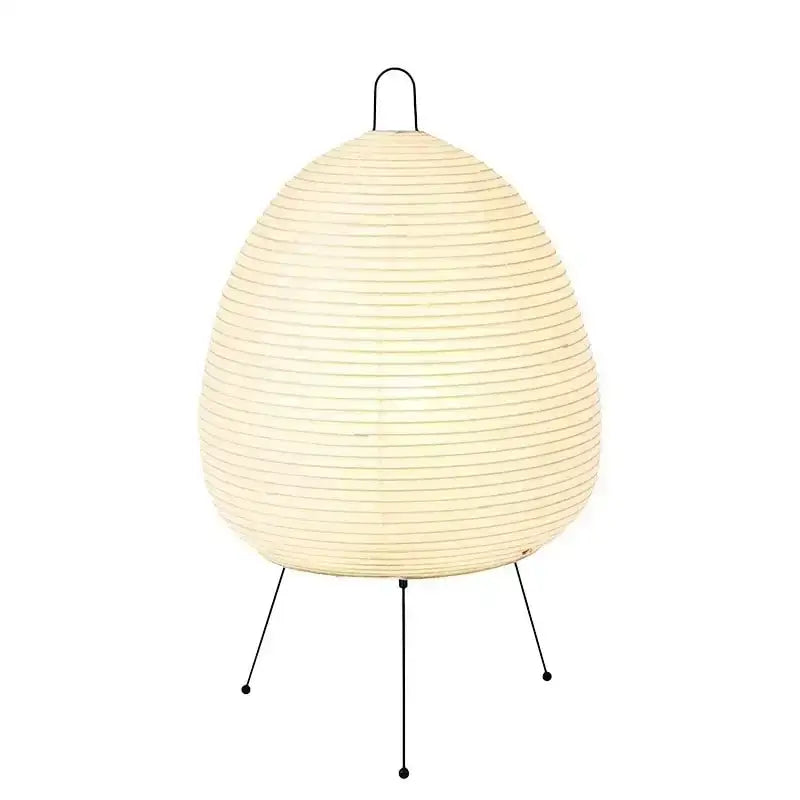 Cream-colored japanese style rice paper table lamp with black metal tripod base by decorbites for bedroom decor