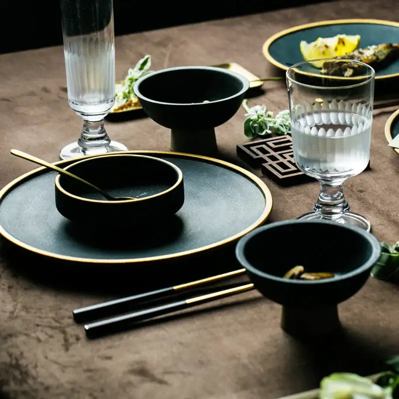 Black ceramic dinner plate set with gold rims decorbites ceramic dinner including bowls chopsticks on rustic table