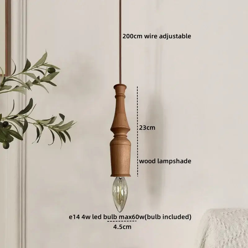A japanese style terracotta ceramic pendant light with a rustic grooved wooden shade and exposed edison bulb for dining room decorbites