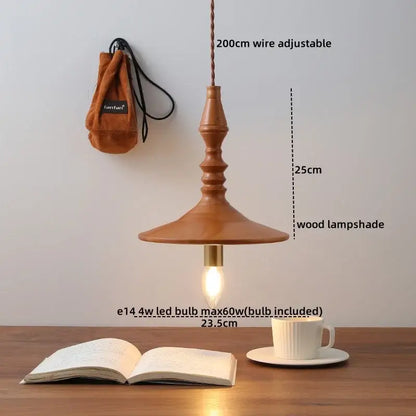 A warm-toned terracotta ceramic japanese style pendant light with a flared wooden lampshade for dining room decorbites