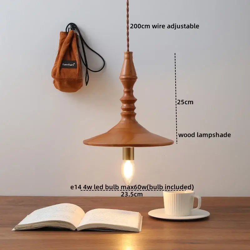 A warm-toned terracotta ceramic japanese style pendant light with a flared wooden lampshade for dining room decorbites