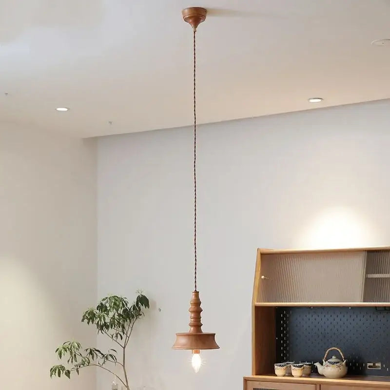 Japanese style pendant light with warm wooden shade and twisted copper chain for dining room decorbites japanese style