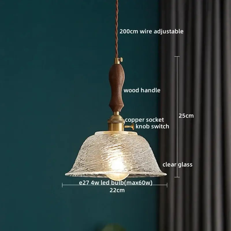Japanese style pendant lamp featuring warm-toned decorbites clear glass shade with wood trim for dining room use
