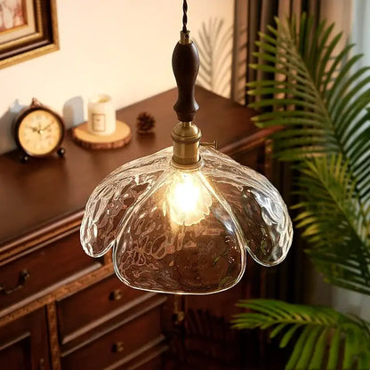 Japanese style clear glass pendant lamp with textured glass, brass fixture, and dark wood pull chain for dining decorbites clear glass decor