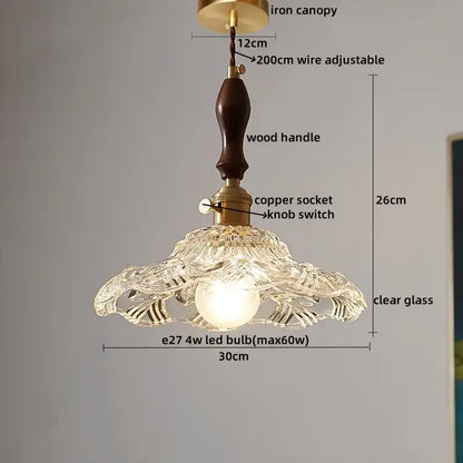 Delicate decorbites clear glass pendant lamp with carved petals and dark wood handle for dining room decor
