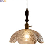 Japanese style clear glass pendant lamp with warm-toned textured glass wood trim and brass hardware for dining room decorbites clear glass