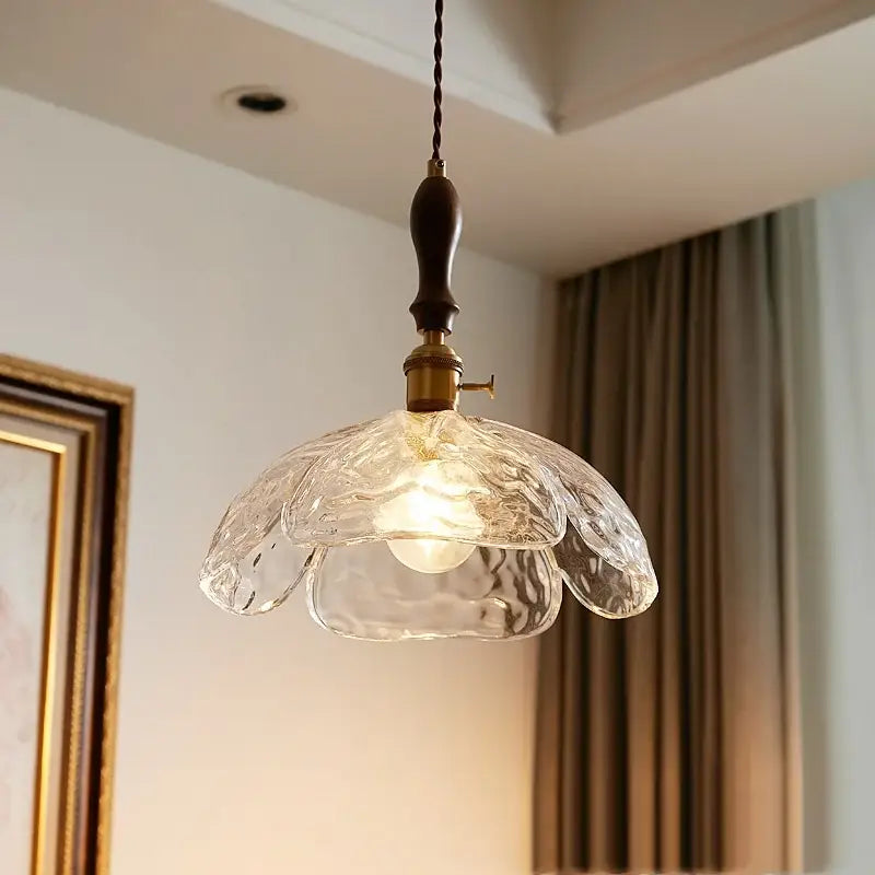 Japanese style clear glass pendant lamp with textured glass, dark wood handle, and brass accents for dining room decorbites clear glass