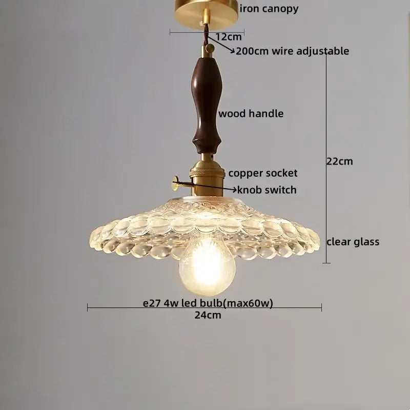 Japanese style pendant lamp with dark wood handle brass fittings and scalloped clear glass shade clear glass pendant decorbites