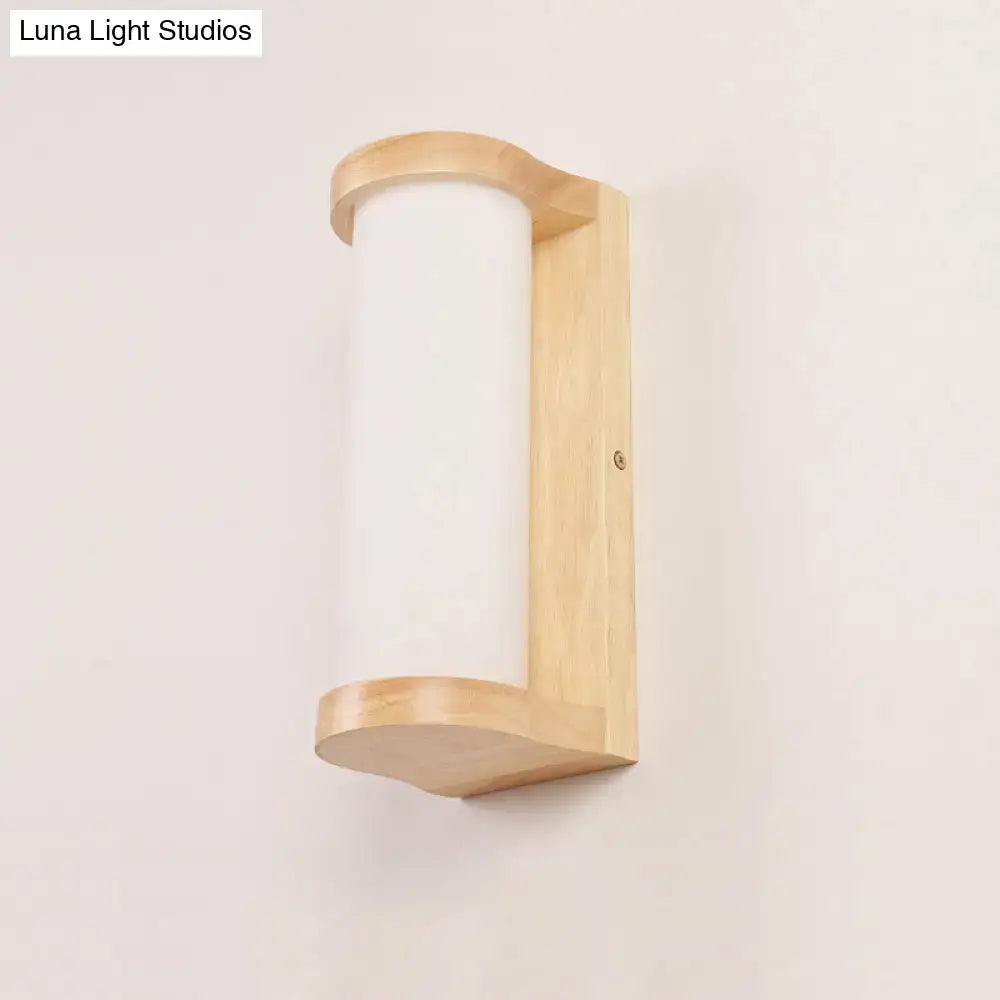 Minimalist Japanese style wall sconce lamp with light wood frame and frosted white glass shade for bedroom use